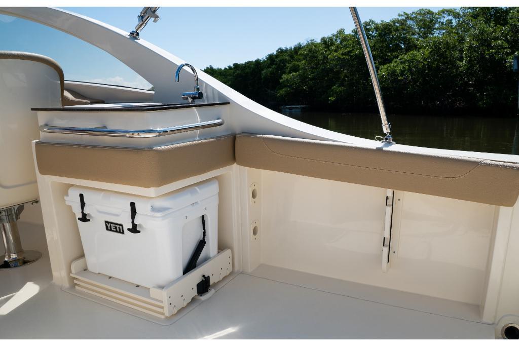 2023 Scout 240 Dorado boat interior with Yeti cooler and seating area.