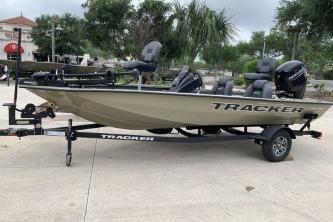 2026 Tracker Pro Team 175 fishing boat on trailer, parked outdoors.