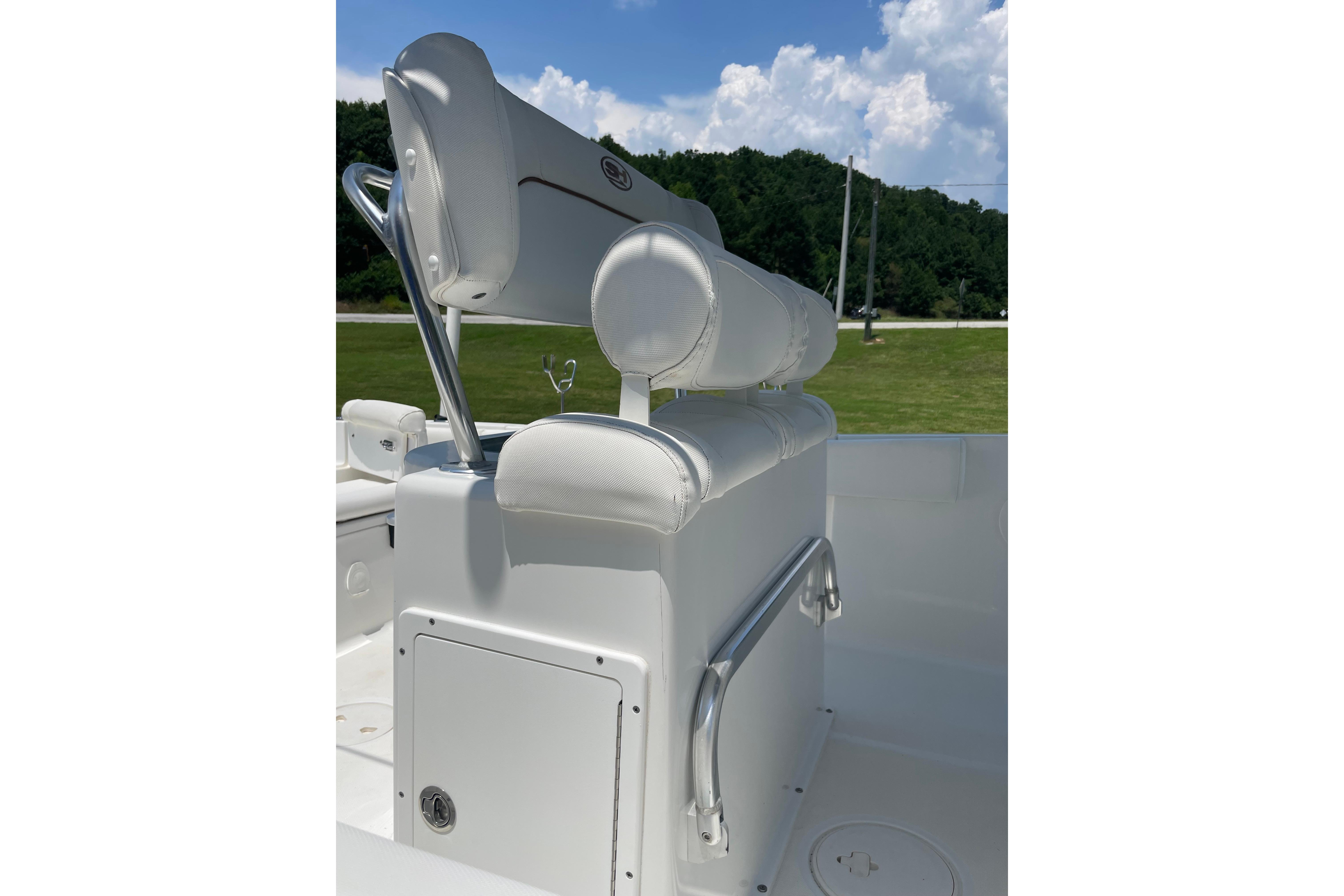 2018 Sea Hunt Ultra 234 boat seating with white upholstery and stainless steel accents.