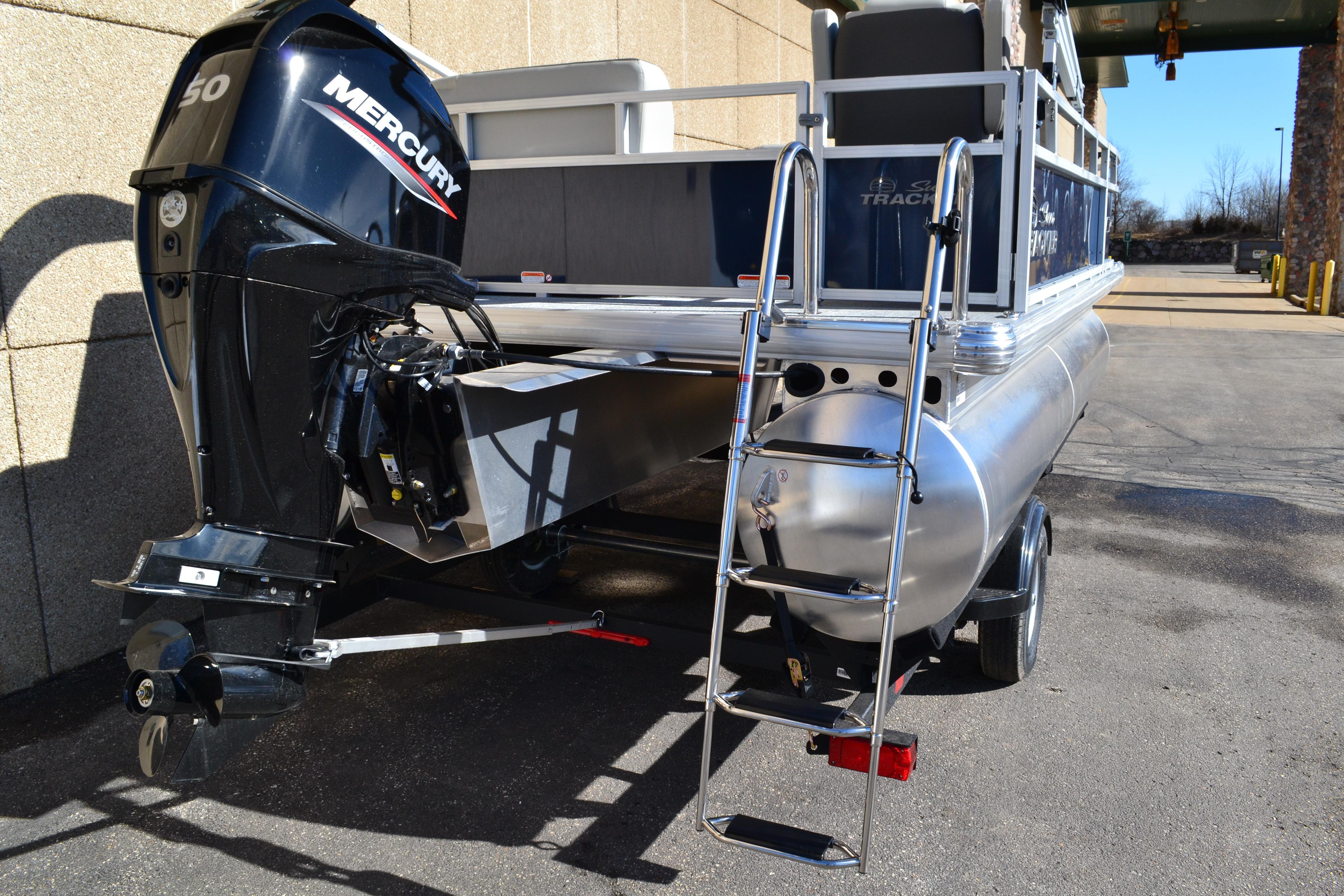 2026 Sun Tracker Bass Buggy 16 XL Select pontoon boat with Mercury outboard motor.