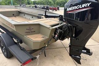 2026 Tracker Grizzly 1756 T Marsh boat with Mercury outboard motor on a trailer.