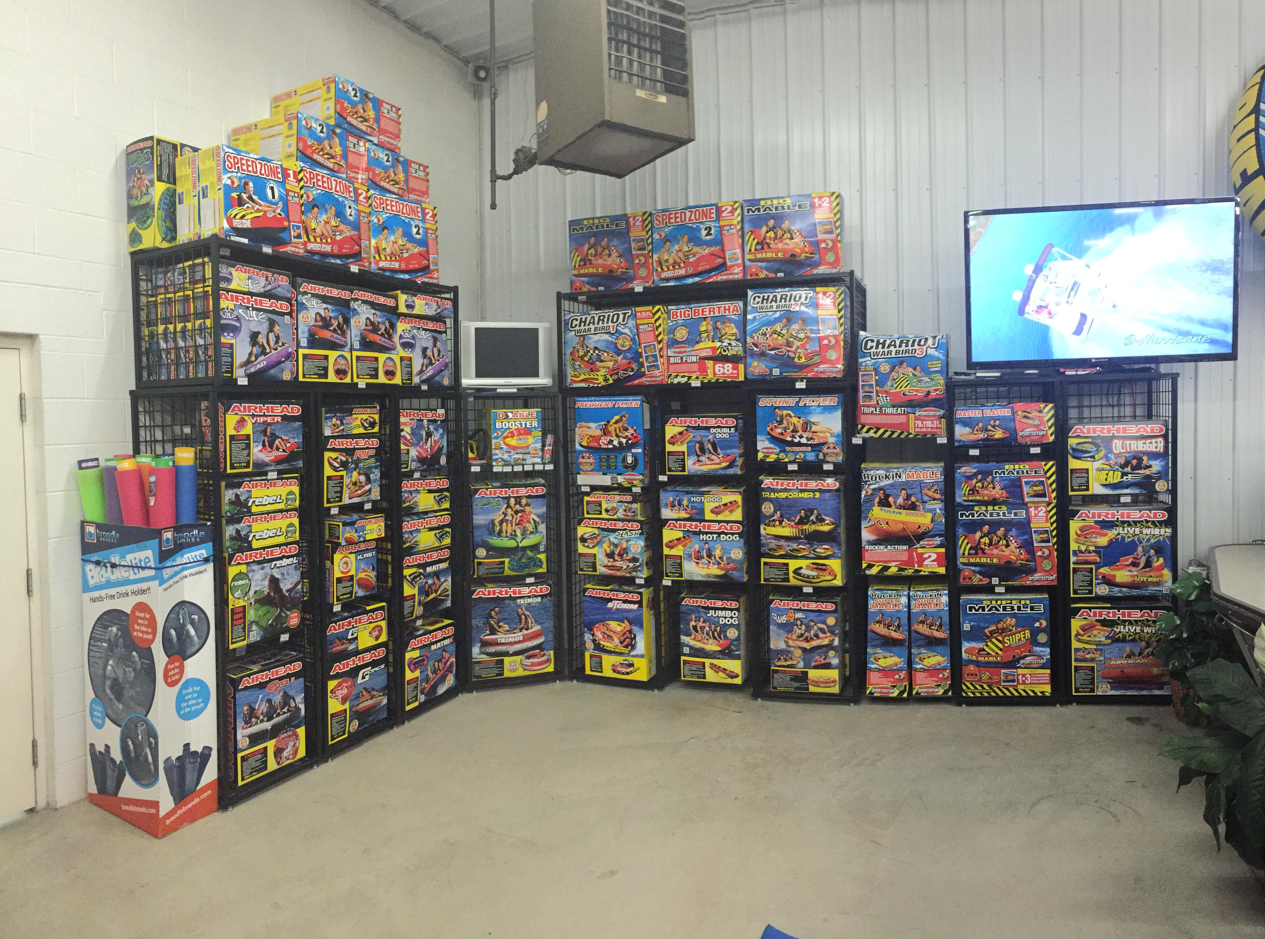 Fireworks display room with colorful boxes and a TV screen.
