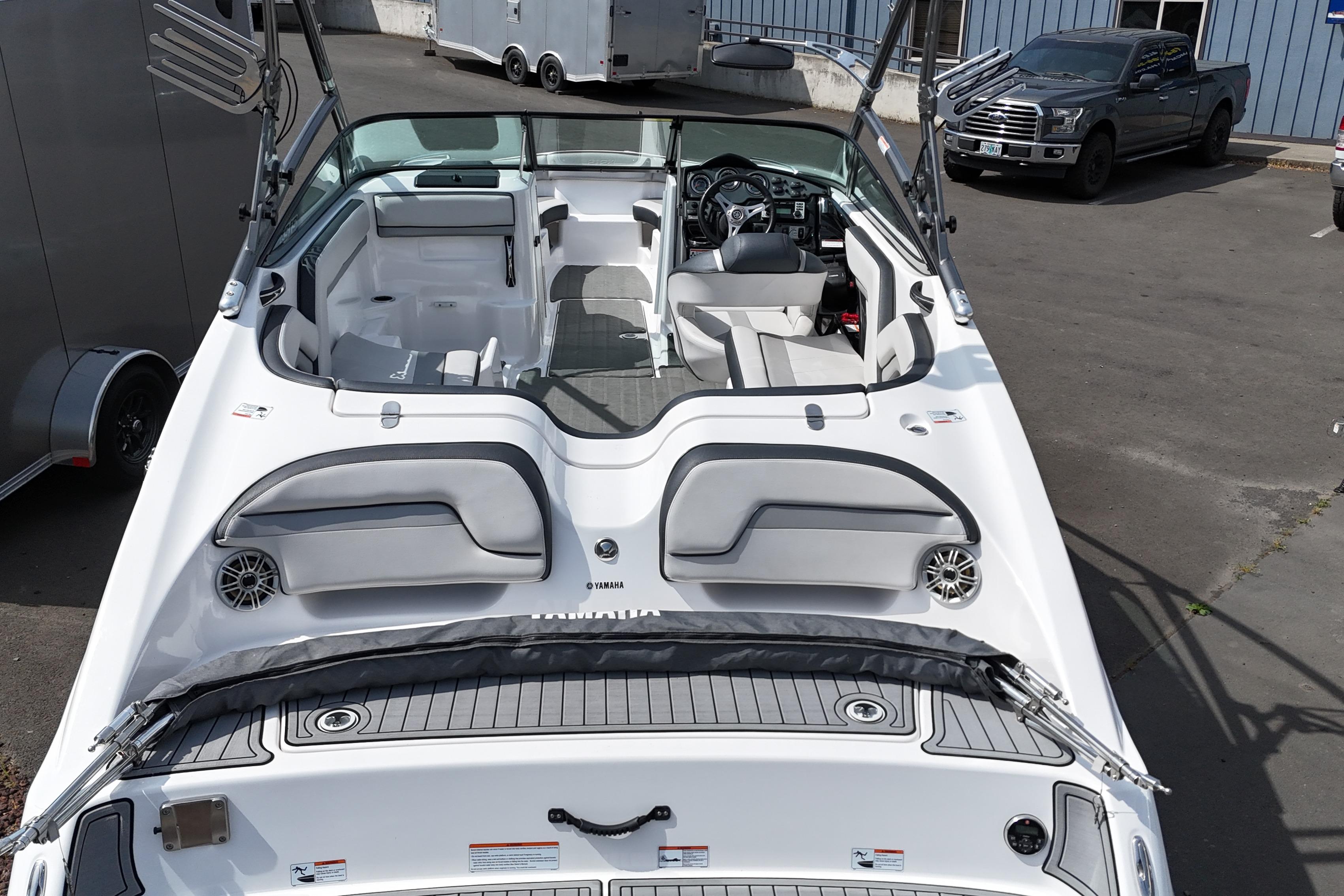 2016 Yamaha Boats 212X interior view, showcasing seating and dashboard features.