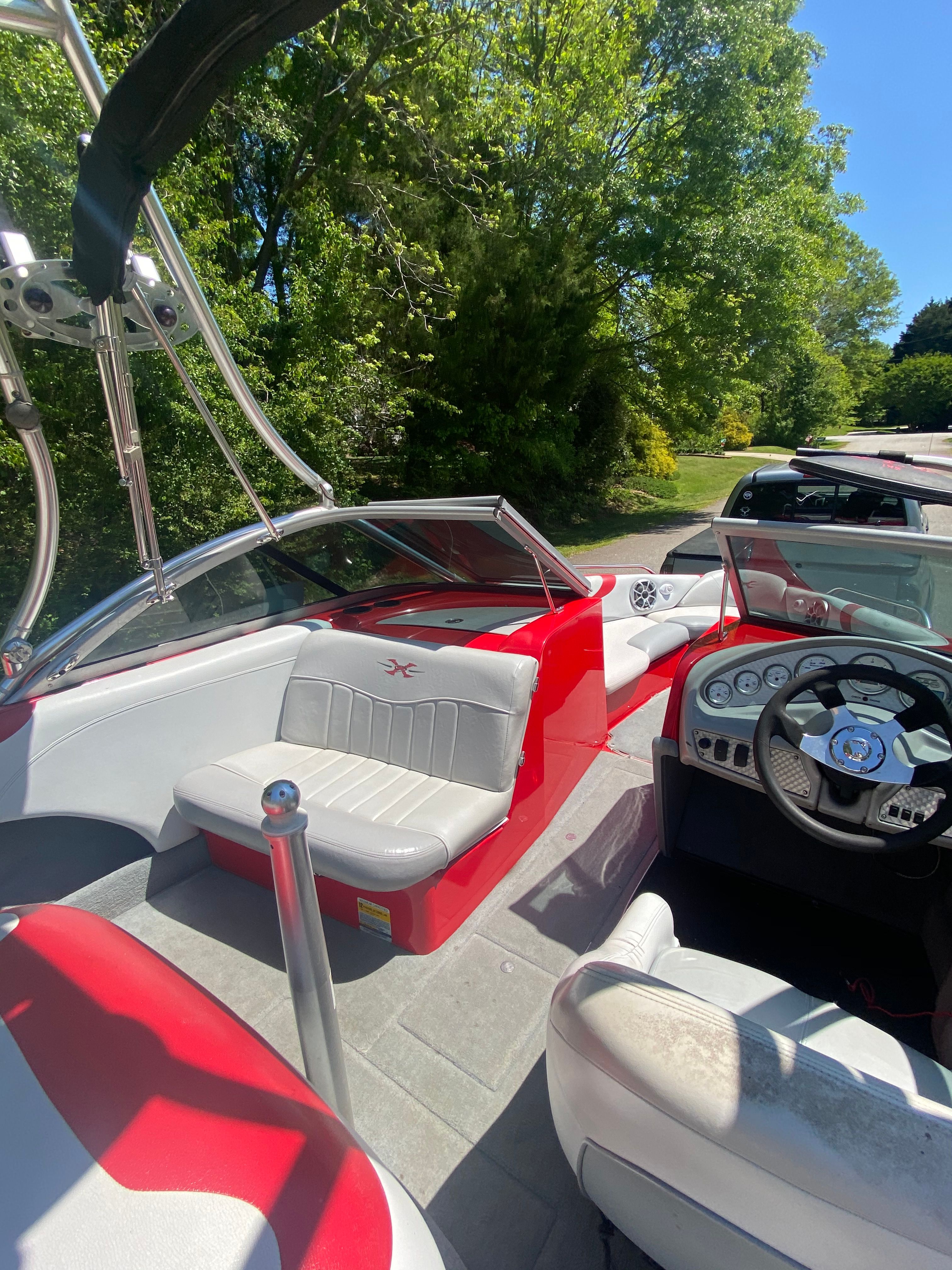 Interior view of a 2004 MasterCraft X-9 boat with red and white seating.
