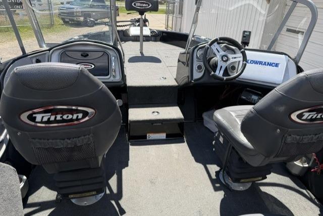 2016 Triton 216 Fishunter boat interior with steering wheel and branded seats.