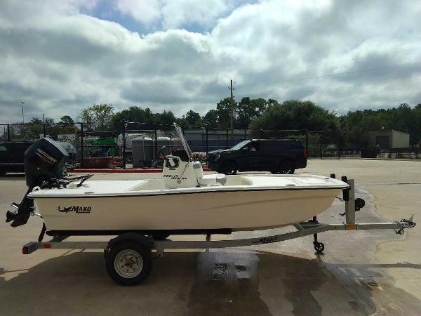 2025 Mako Pro Skiff 13 CC boat on trailer in parking lot.