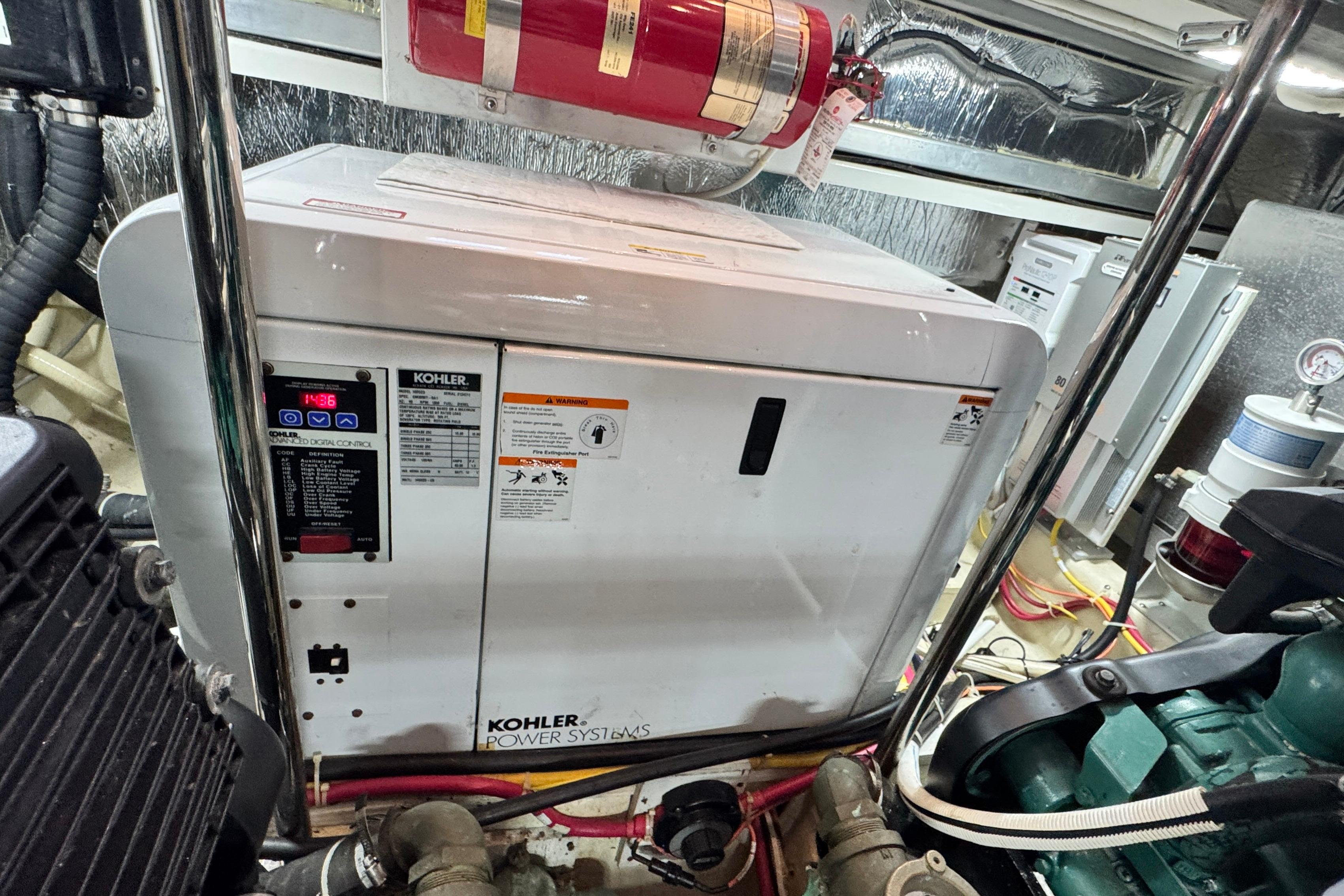 Engine room of 2007 Carver 47 Motor Yacht with Kohler power system.