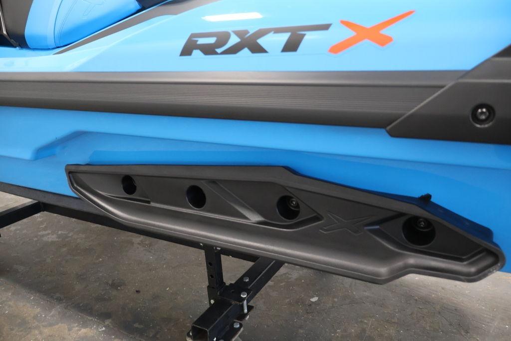 2026 Sea-Doo RXT-X 325 in blue, showcasing sleek design and branding details.