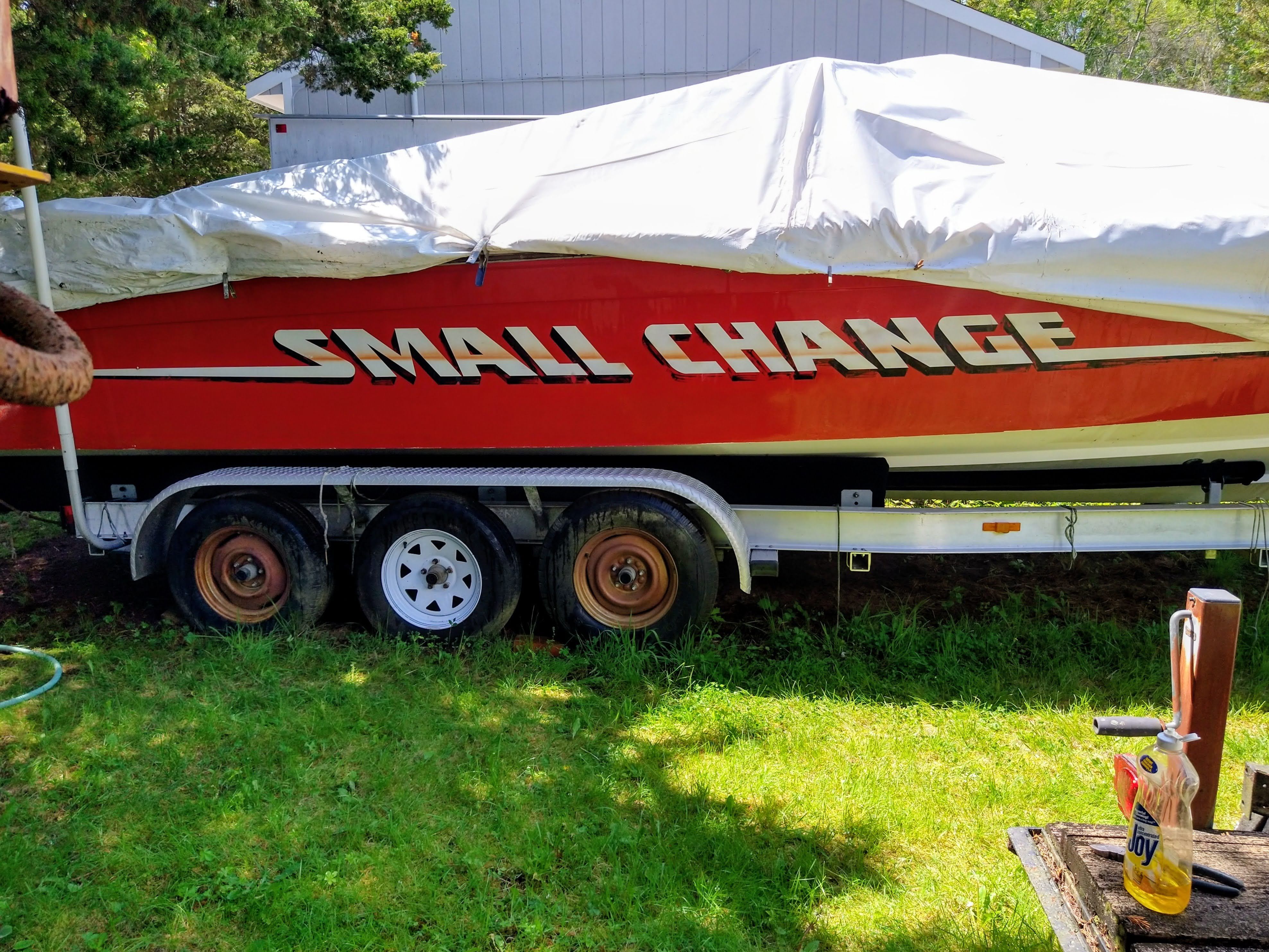 1986 Corsa Performance Boat covered on trailer.