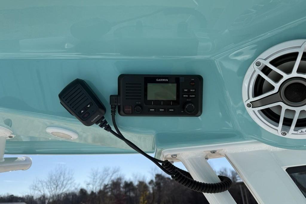 2026 Sportsman Masters 247OE Bay Boat with Garmin radio and JL Audio speaker.