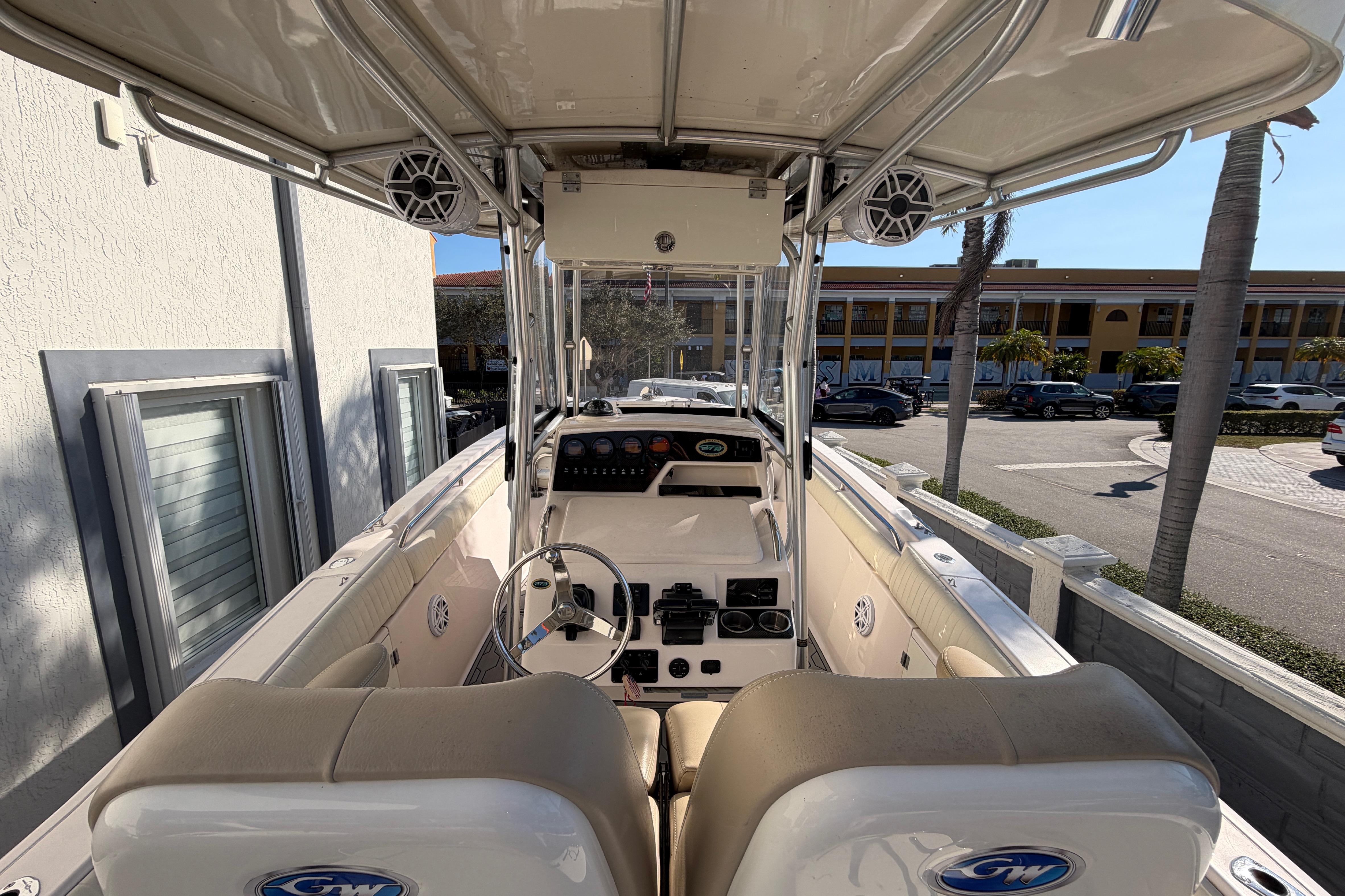 2004 Grady White 273 boat interior with steering wheel and control panel.