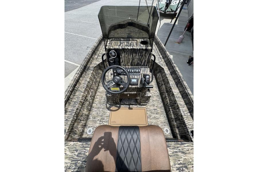2027 Excel 230 Bay Pro Elite boat interior with camouflage design and steering console.