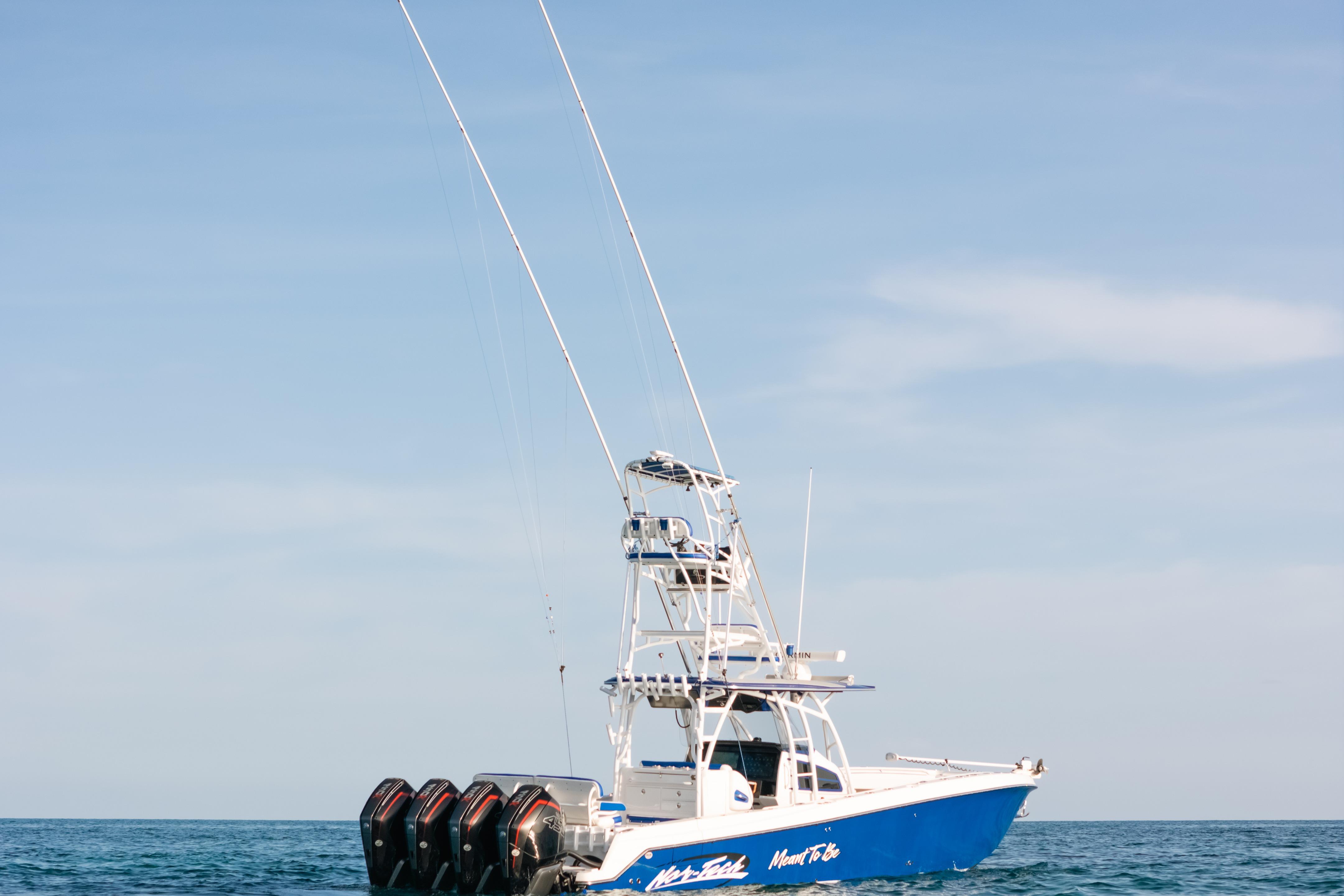 2022 Nor-Tech 392 Super Fish boat on open water, featuring multiple outboard engines.
