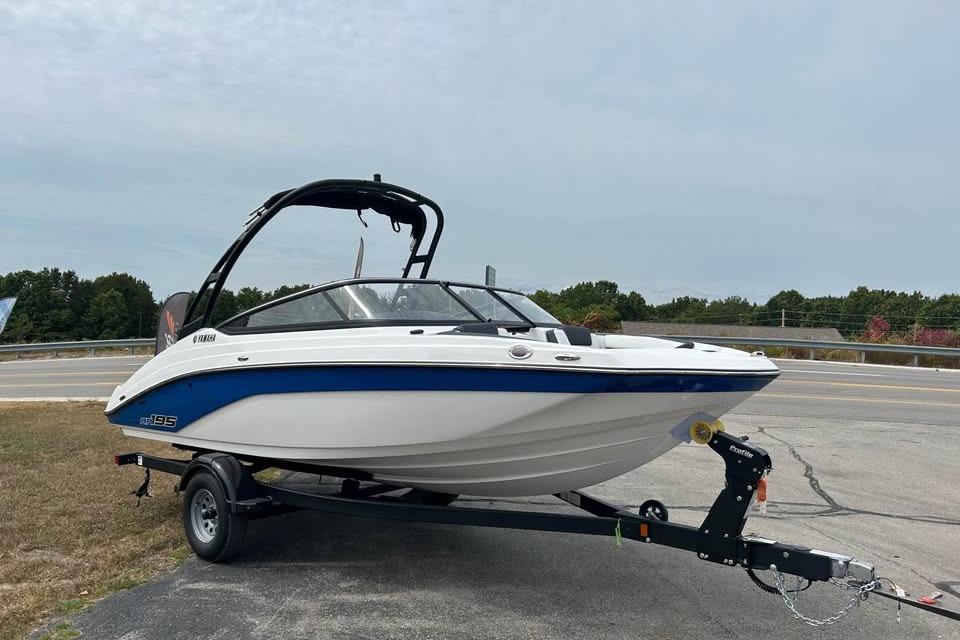 2026 Yamaha Boats AR195 on trailer, parked outdoors near a road.