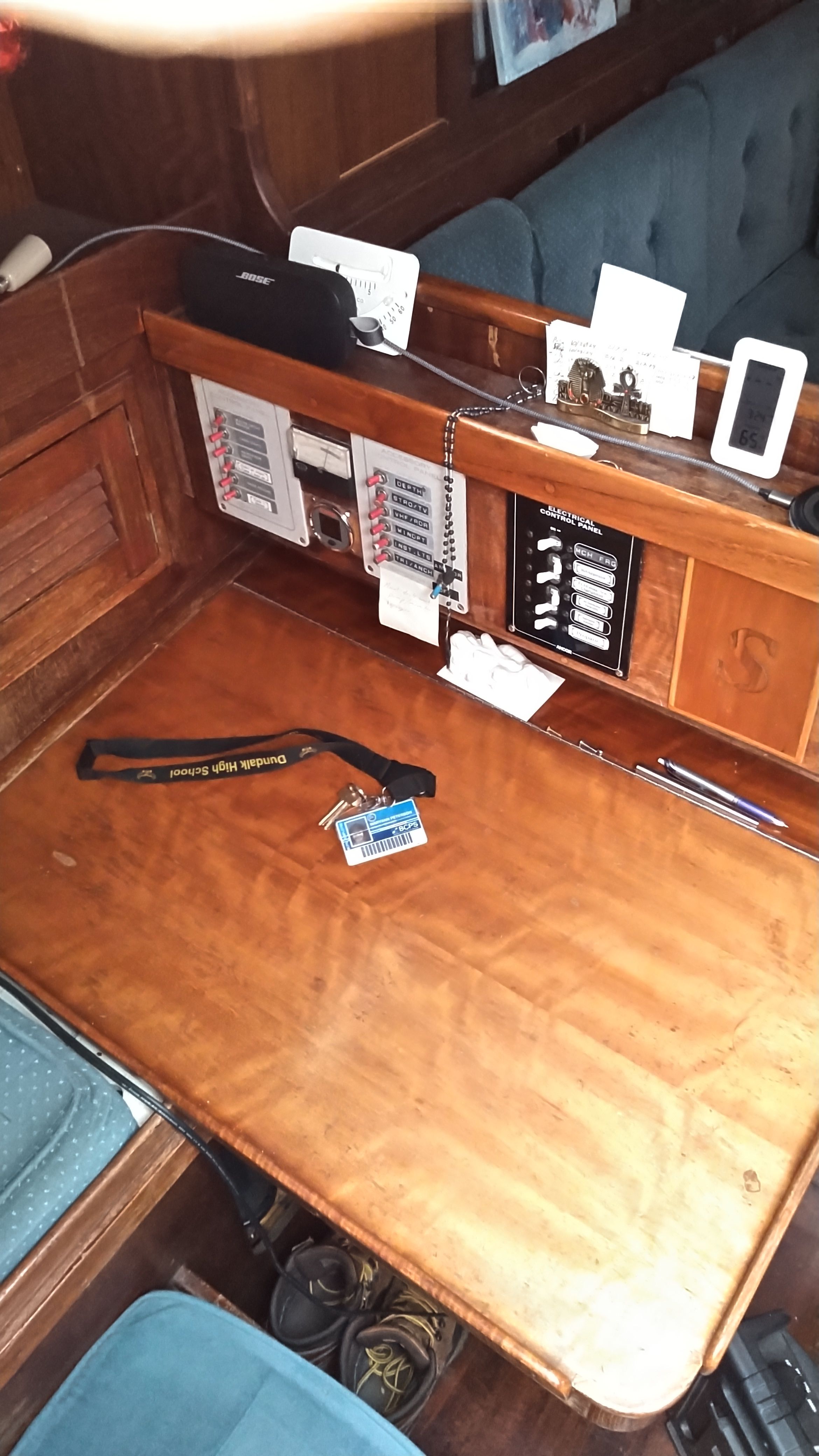 Interior of a 1978 Tartan 37 sailboat with wooden table and control panel.