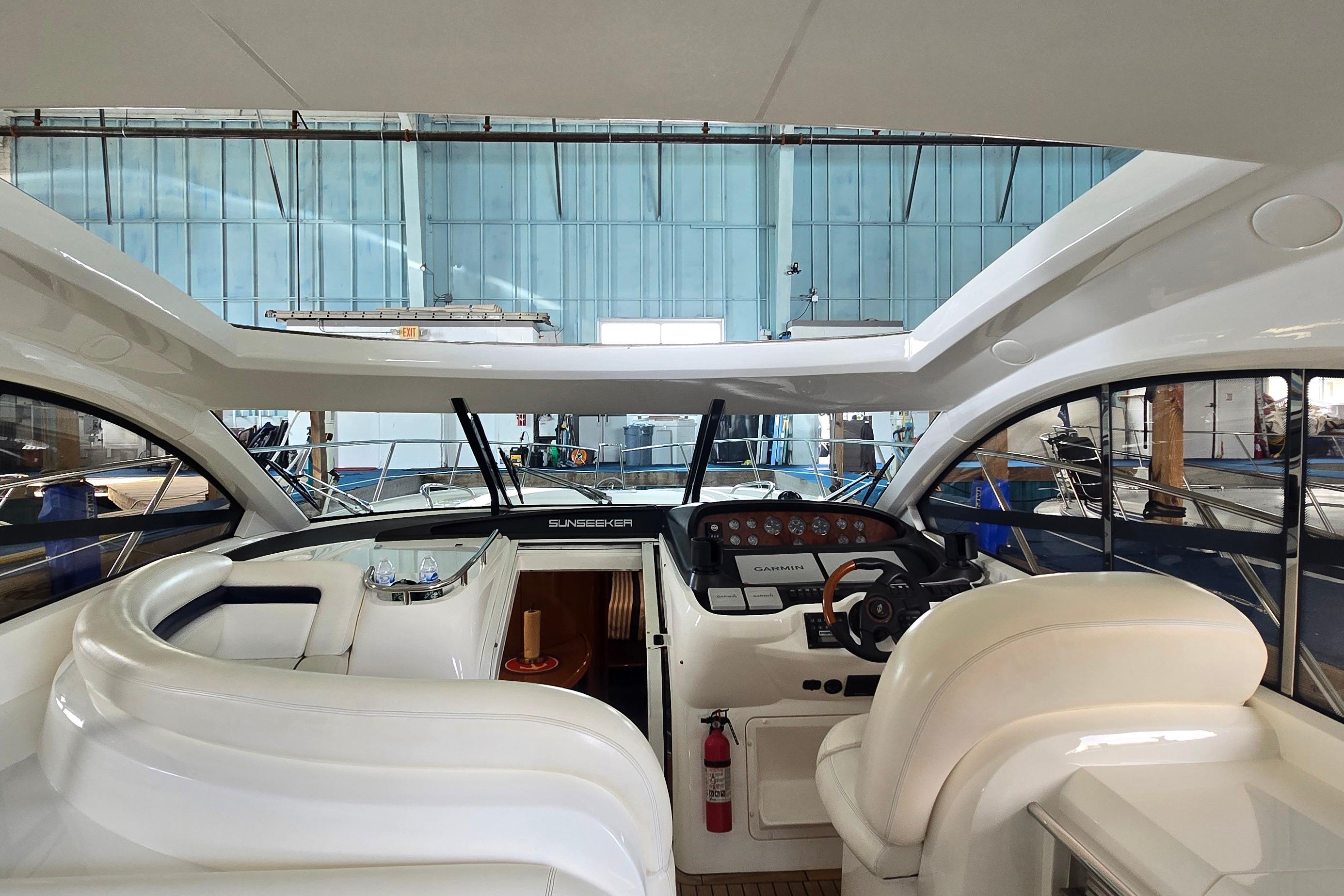 Interior view of 2004 Sunseeker Camargue 50 yacht with helm and seating area.