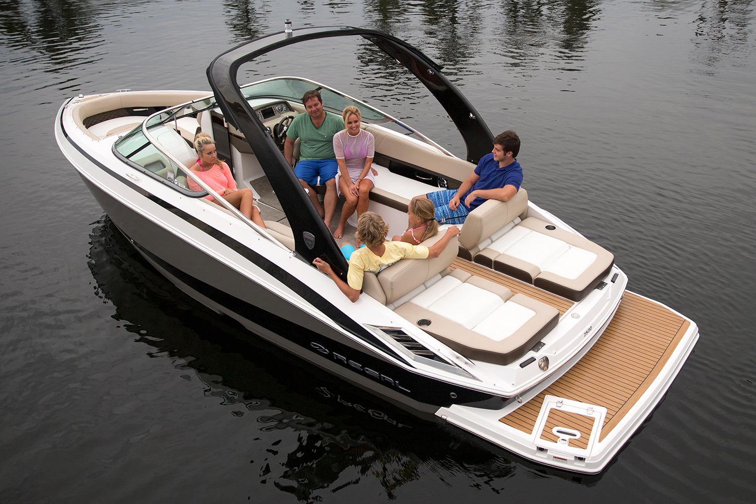 Manufacturer Provided Image: 2017 Regal 2500 Bowrider boat with passengers on a calm lake.