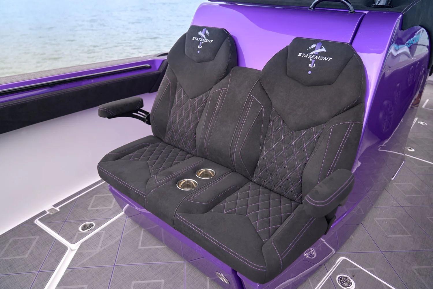 Manufacturer Provided Image: Luxurious seating on 2026 Statement 380 Open boat, featuring purple accents and cup holders.