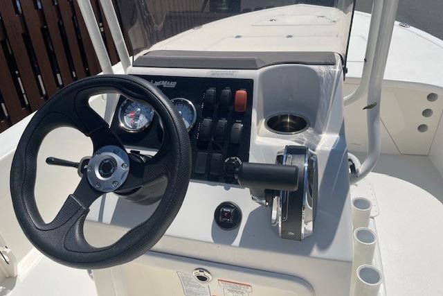 2026 Mako 18 Pro Skiff boat console with steering wheel and controls.