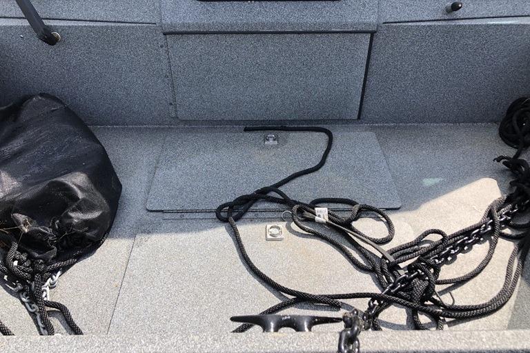 2023 Alumaweld Talon 18 boat interior with ropes and storage compartment.