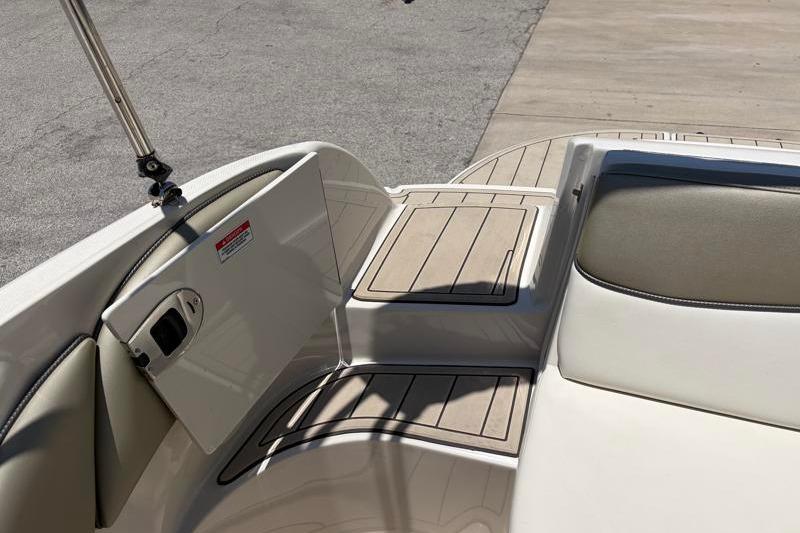 2007 Sea Ray 240 Sundeck boat interior with cushioned seating and deck details.