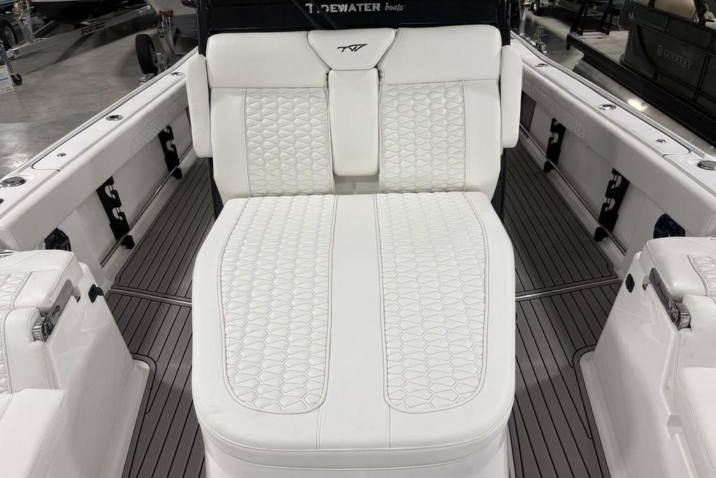 2026 Tidewater 3100 Carolina Bay boat with luxurious white seating and sleek design.