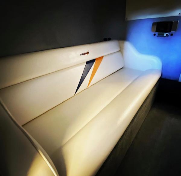 2001 Eliminator Eagle boat interior with white leather seating and modern design.