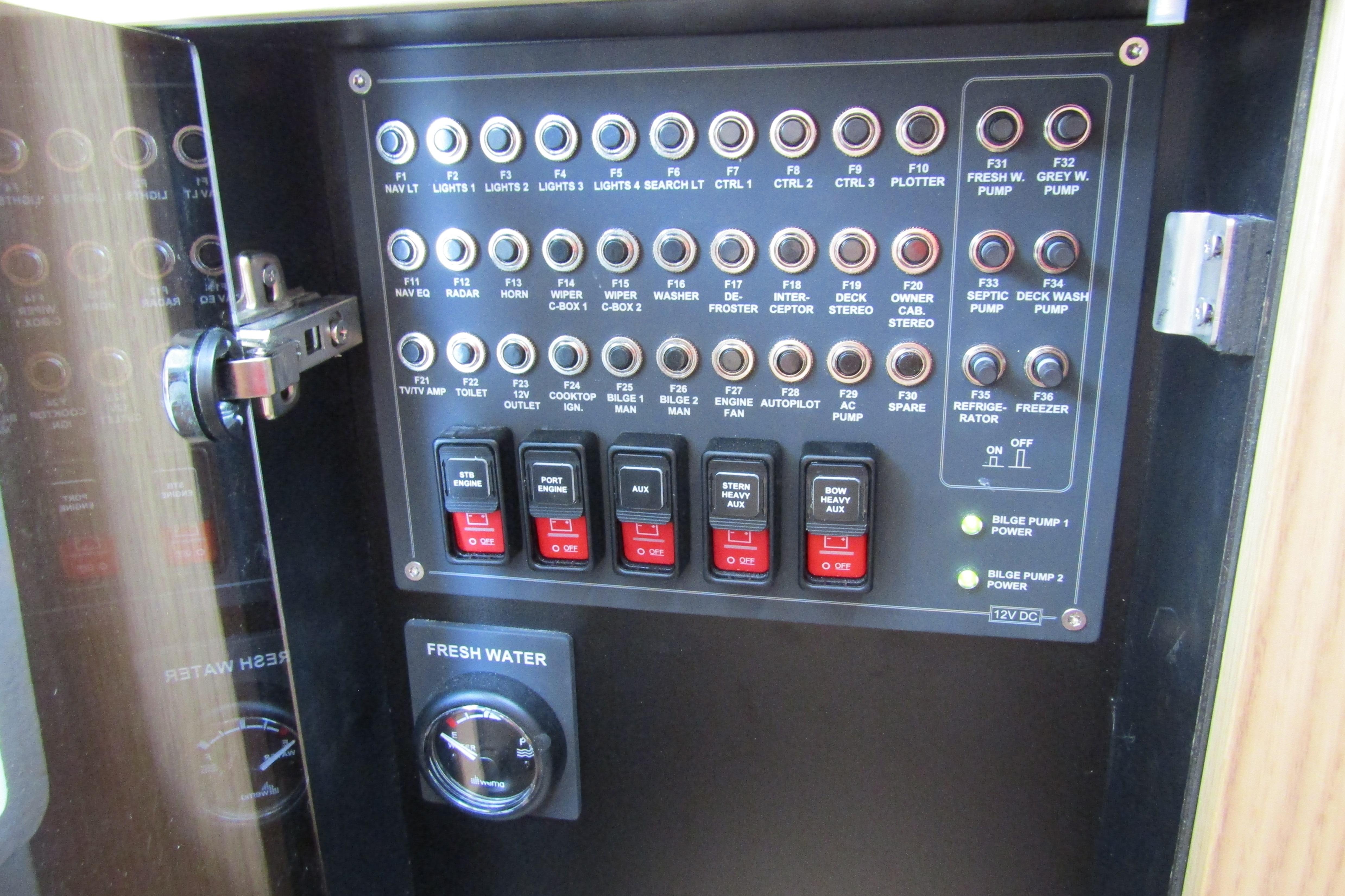 Control panel of a 2025 Nimbus Tender 11 boat with switches and indicators.