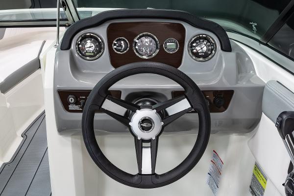Manufacturer Provided Image: 2025 Chaparral 21 SSi boat dashboard with steering wheel and gauges.