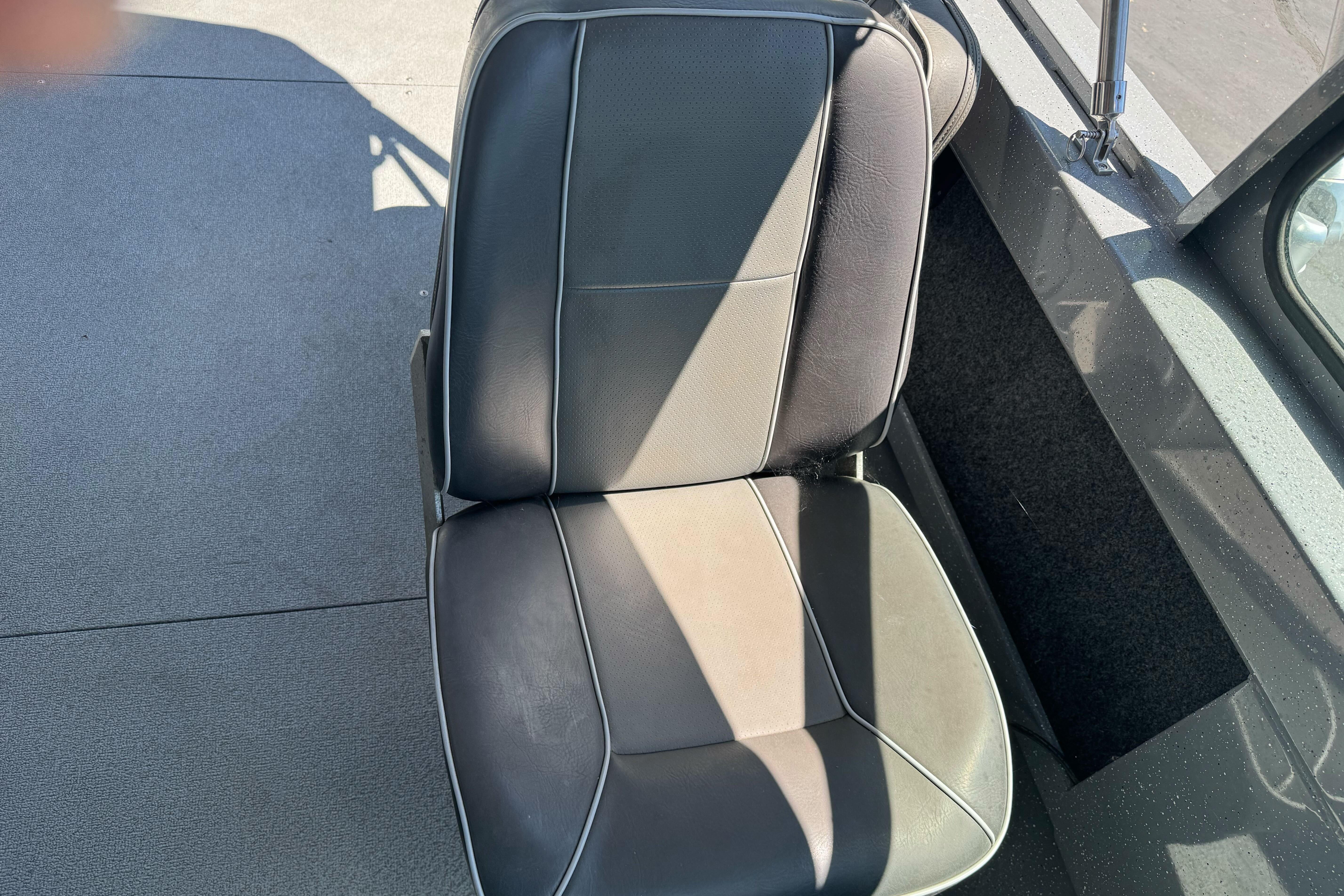 Black seat in a 2014 River Hawk 19 GB boat interior.