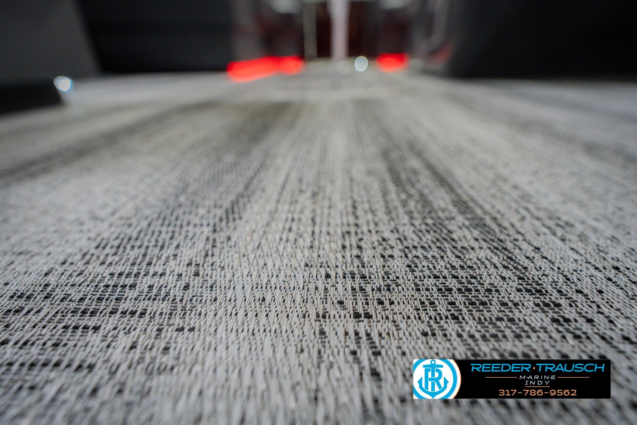 2026 Bennington 22 SSB boat flooring with textured design, Reeder-Trausch Marine logo.