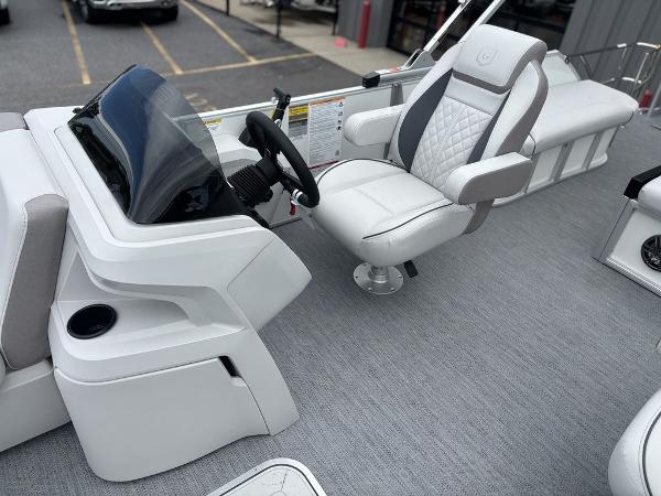 2025 Godfrey SWEETWATER 2286 SFL boat interior with captain's chair and console.