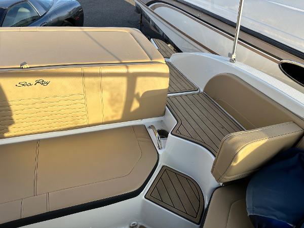 Interior of a 2021 Sea Ray SPX 190 boat with beige seating.
