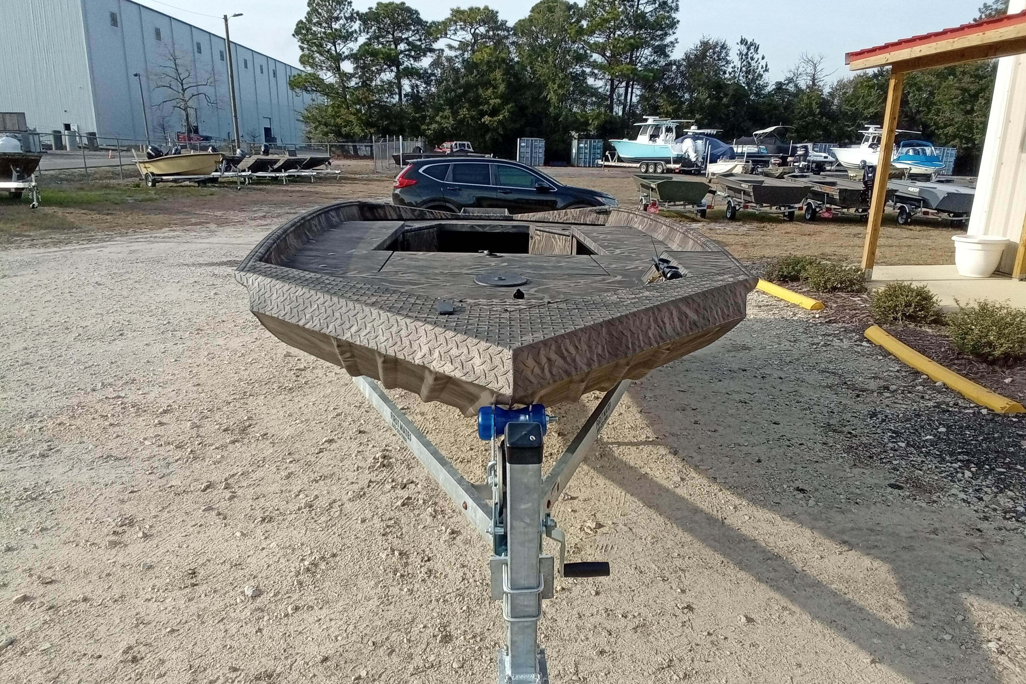 2026 Alweld 1756 Invader boat on trailer in outdoor lot.