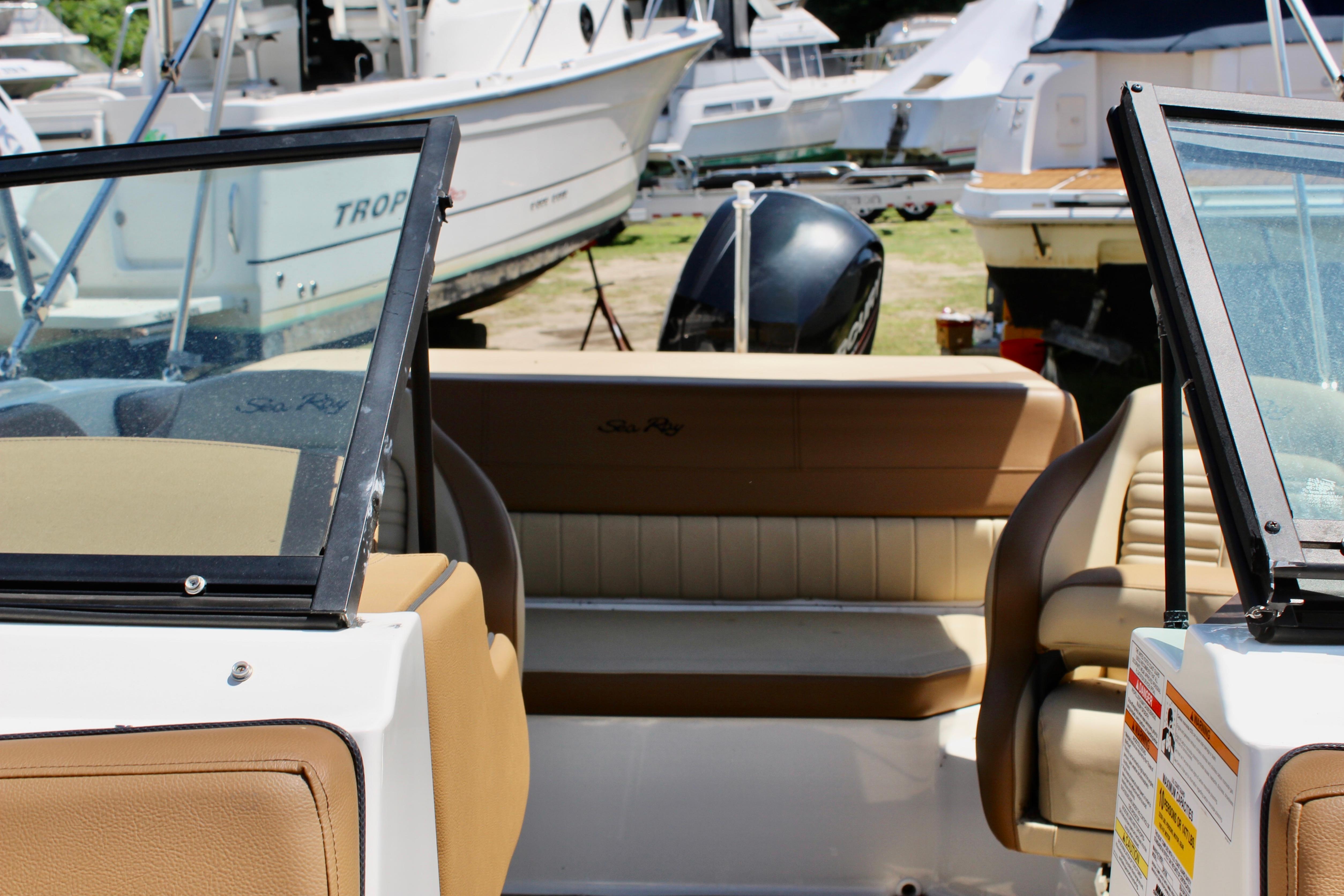2018 Sea Ray SPX 190 Outboard boat interior with tan seating and windshield.