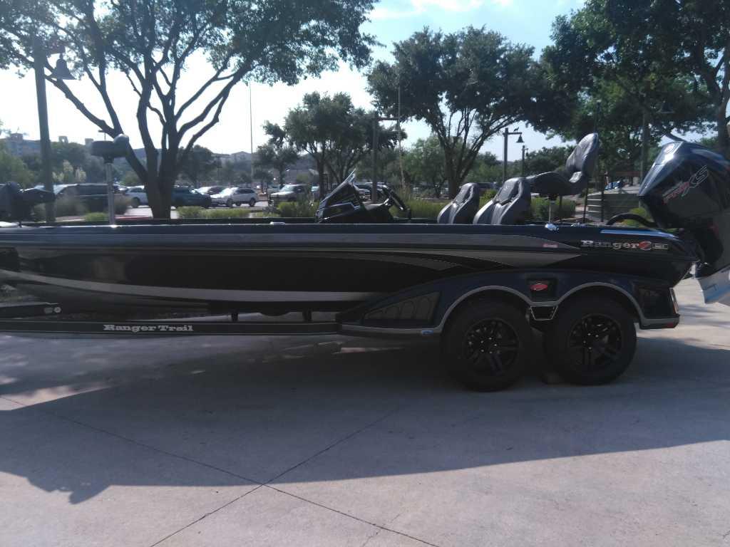 2025 Ranger Z521R Cup-Equipped boat on trailer, parked outdoors.