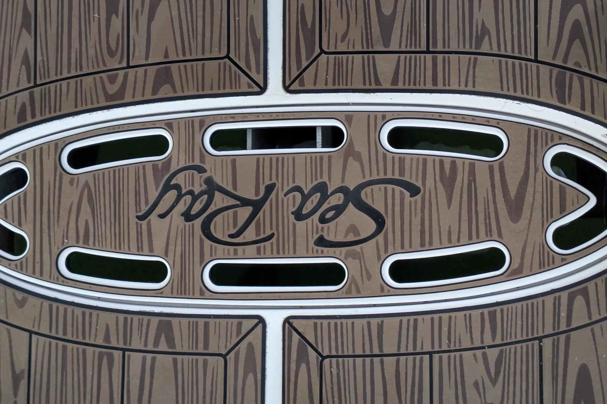 Teak-patterned deck of 2002 Sea Ray Sundancer 320 with logo.