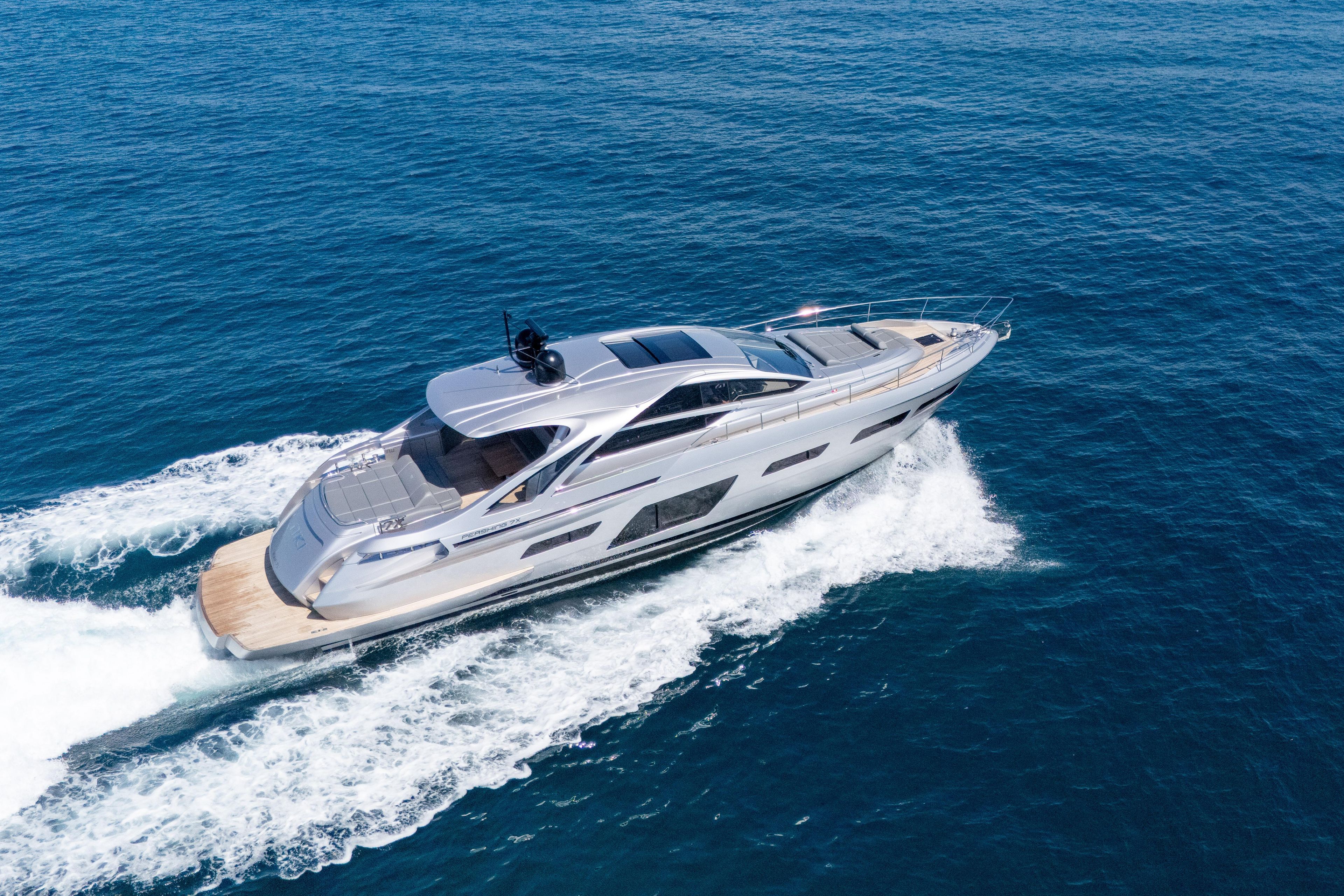 2024 Pershing 7X yacht cruising on open blue sea, showcasing sleek design and luxury.