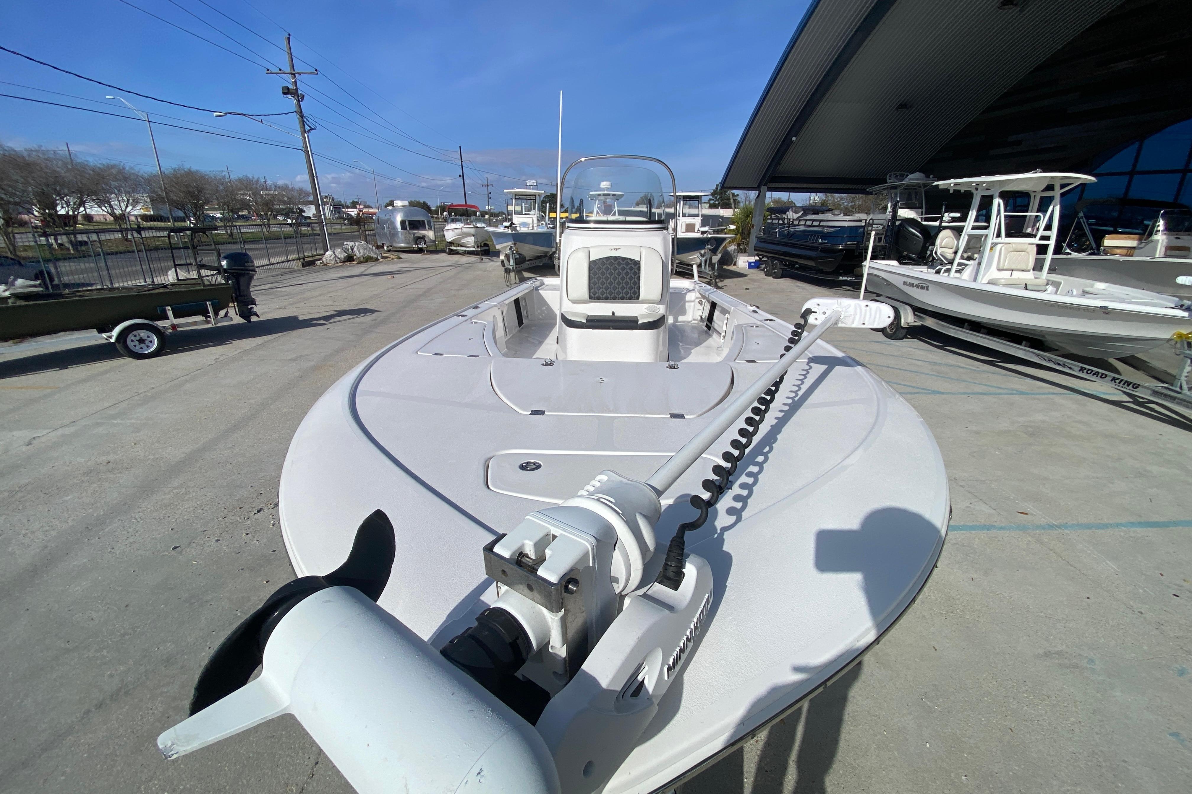 2023 Tidewater 2410 Bay Max boat displayed outdoors, featuring a sleek design and modern equipment.