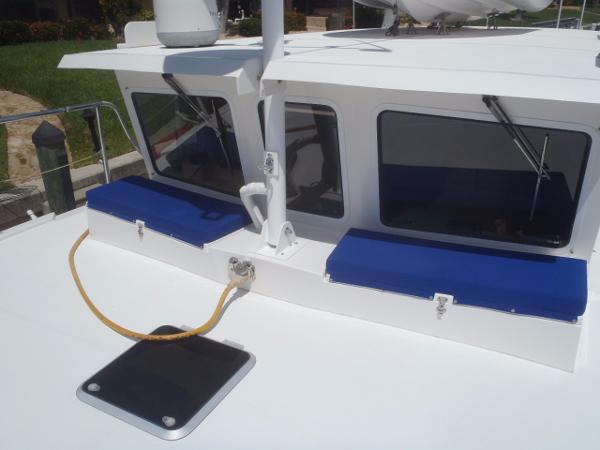 2025 Great Harbour N40 boat deck with blue cushions and windows.