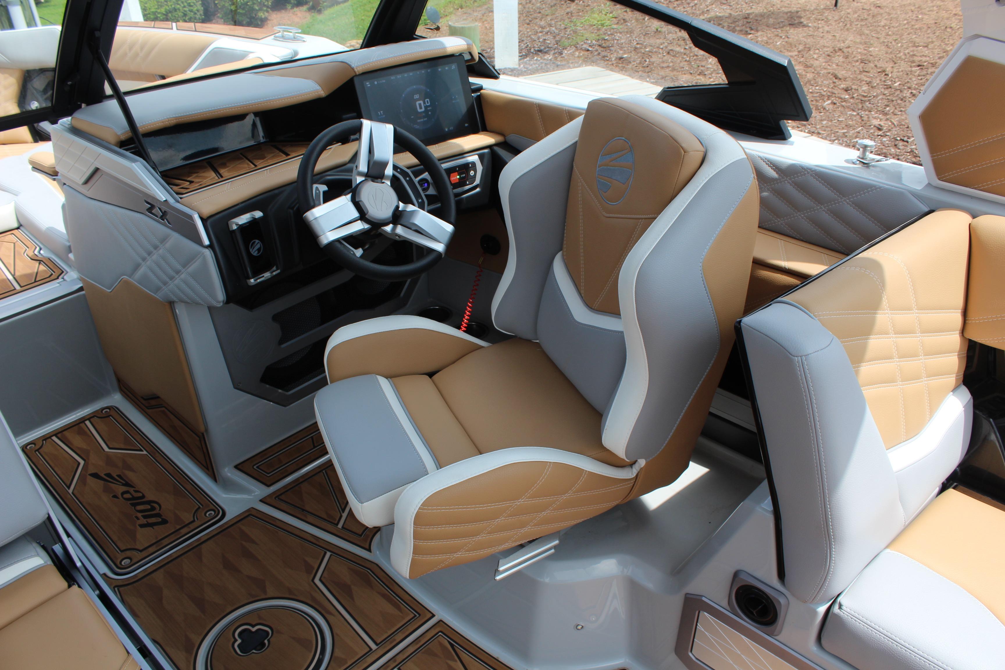 2024 Tigé Ultré 25ZX boat interior with luxury seating and modern dashboard design.