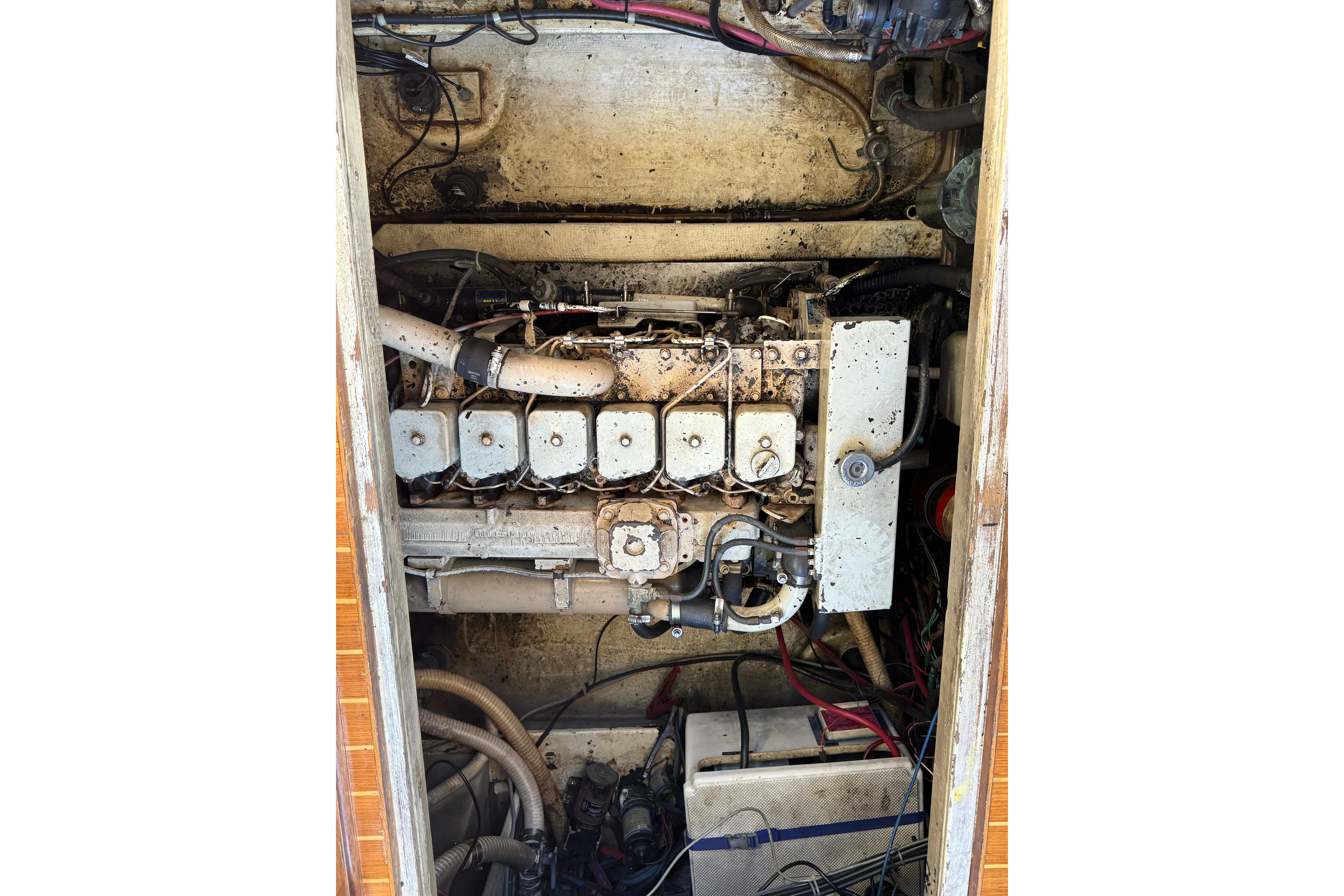 Engine compartment of a 1996 Nordic Tug 32, showing mechanical components and wiring.