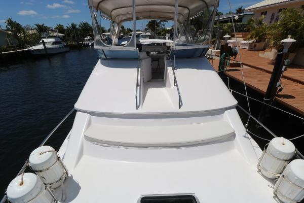 1992 Sea Ray 350 Express Bridge docked at a marina.