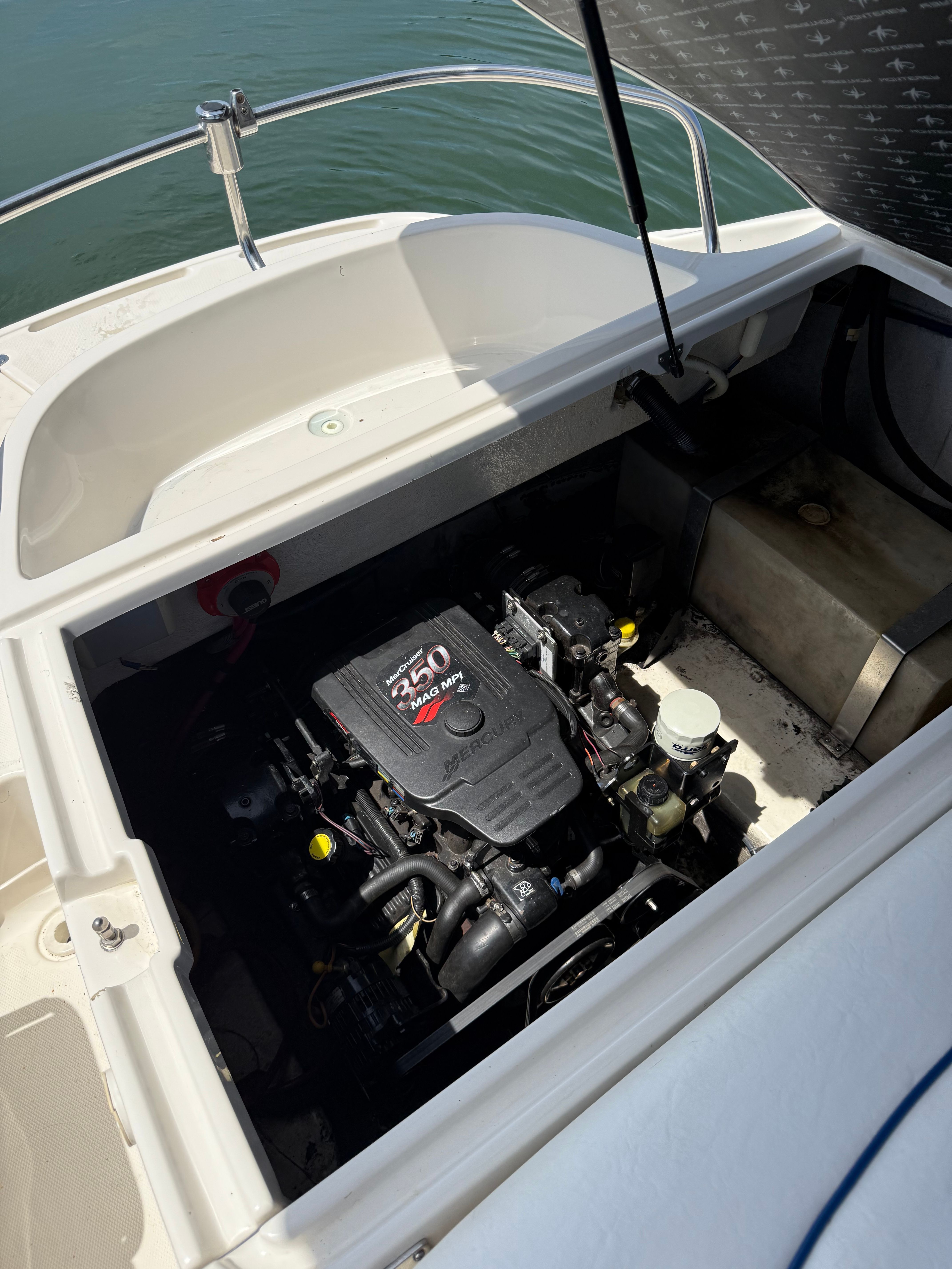 An open engine compartment of a 2005 Monterey 223 Explorer Sport with a 250 HP engine.