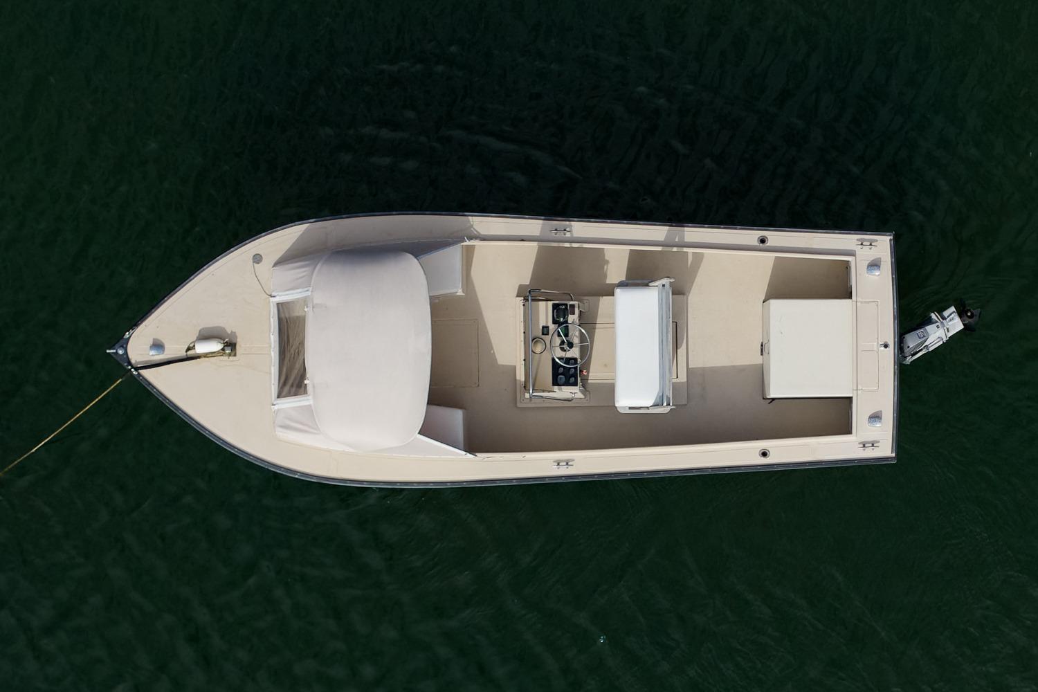Overhead view of 1989 Ellis 24 Open boat on water.