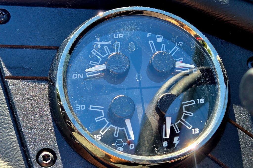 Close-up of 2026 Skeeter ZXE20 dashboard gauges with reflections.