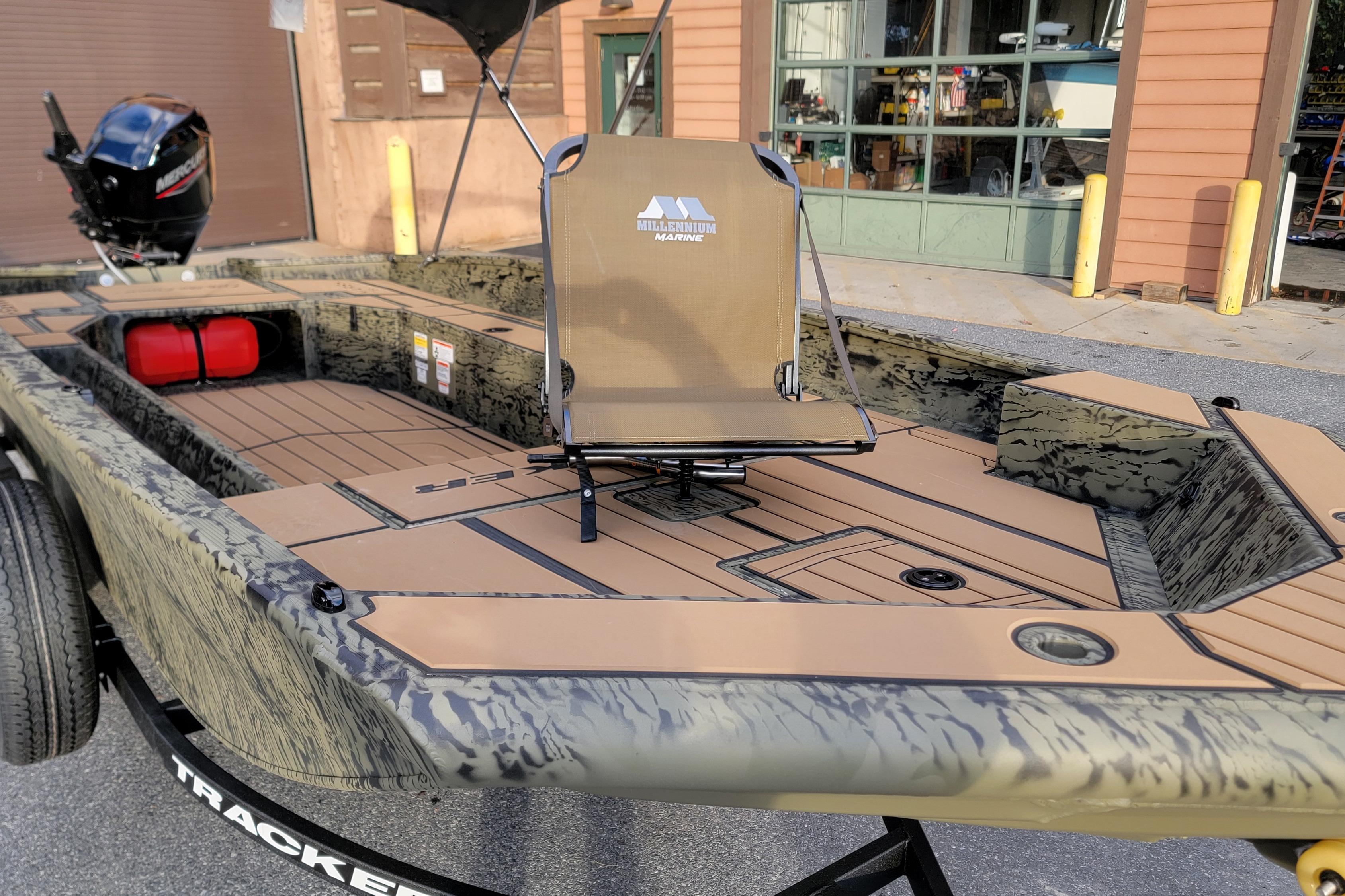 2026 Tracker Grizzly 1756 T Marsh boat with camo design and fishing chair.