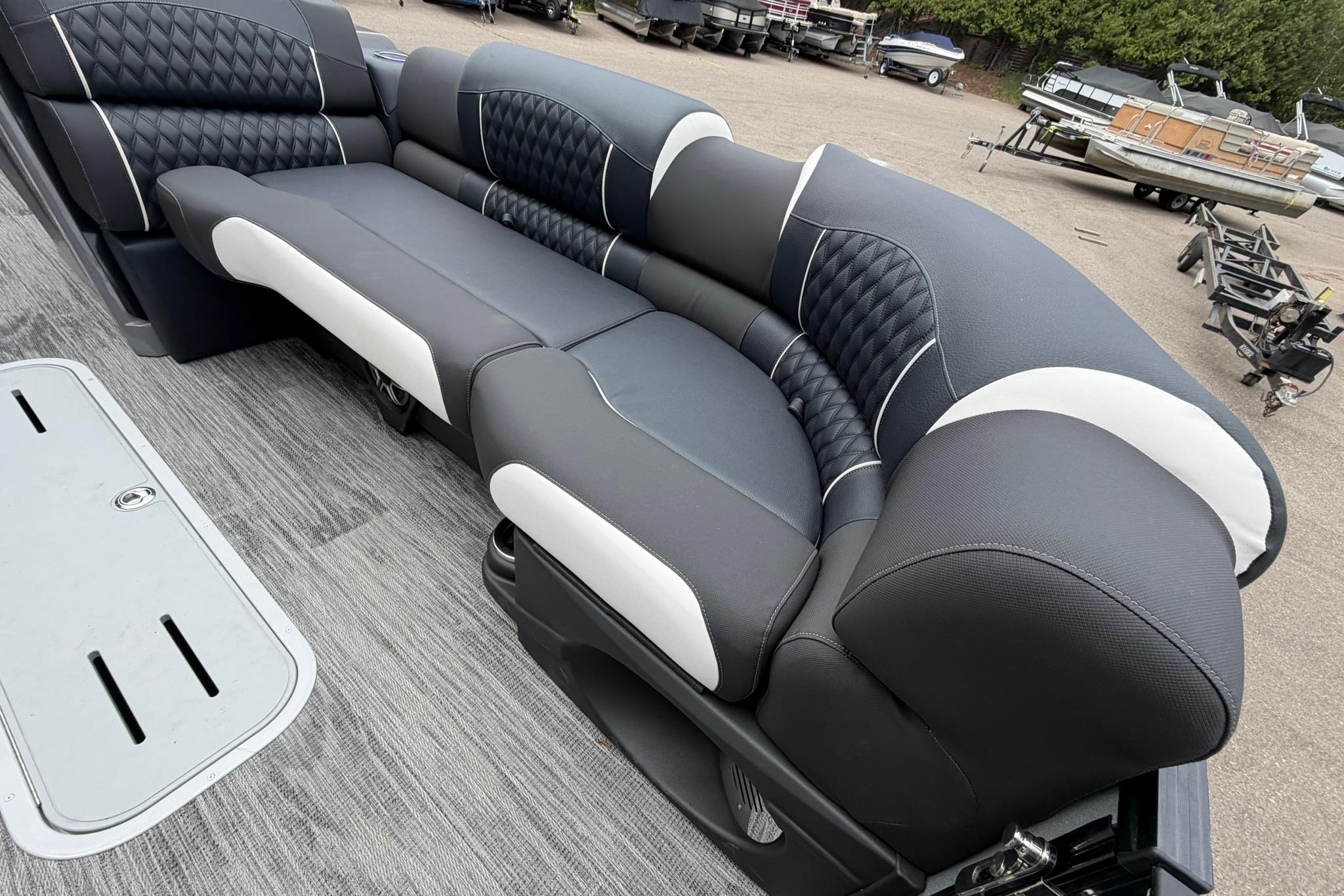 Luxurious seating on 2026 Avalon Excalibur LTD Flex Lounge Windshield boat, showcasing elegant design.