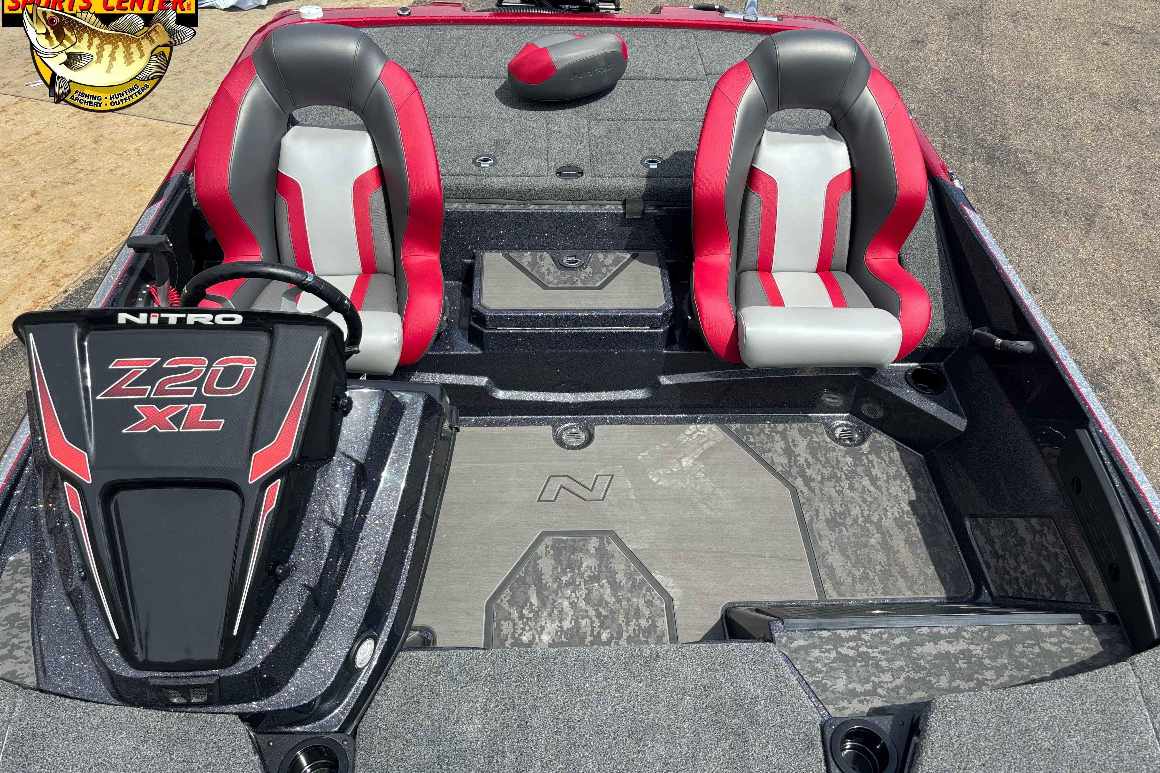 2026 Nitro Z20 XL Pro boat interior with red and gray seats, steering console, and deck.