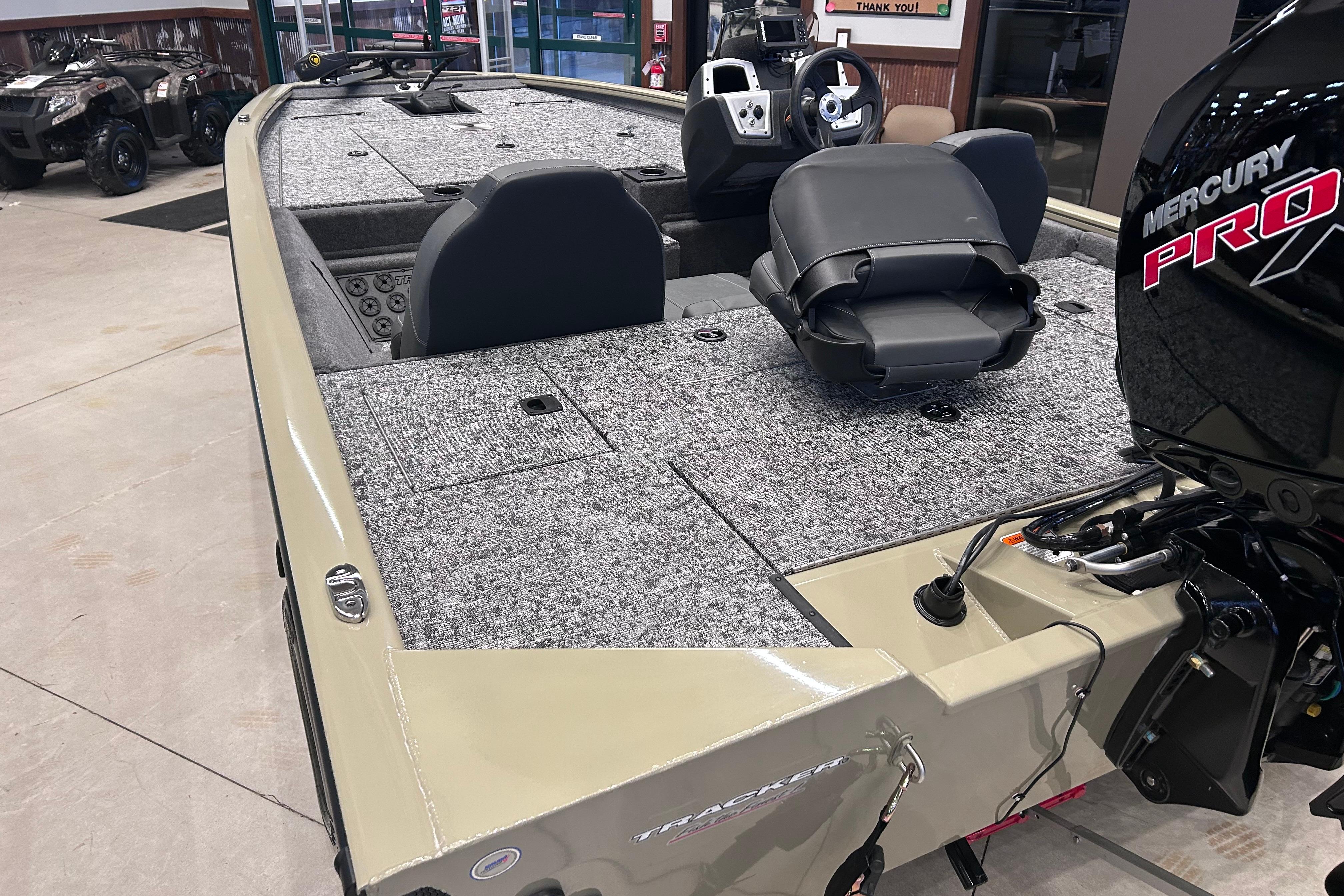 2026 Tracker Pro Team 195 boat with Mercury Pro engine, featuring spacious seating and carpeted deck.